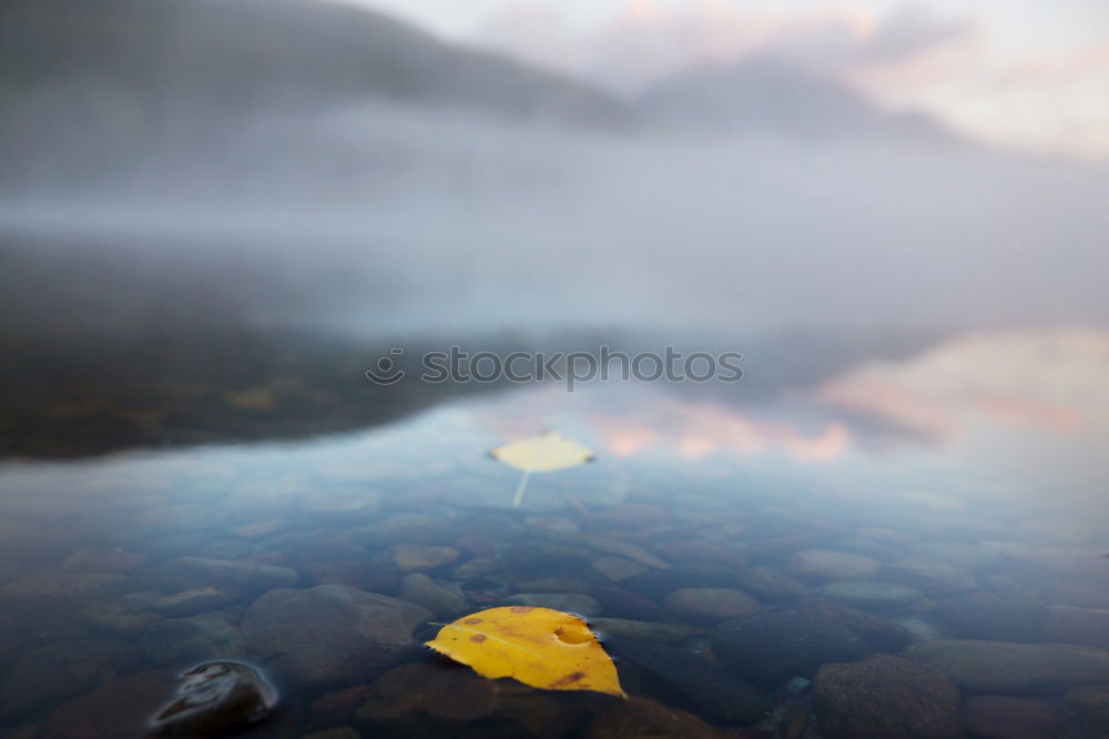 Similar – Rain clouds and their reflection