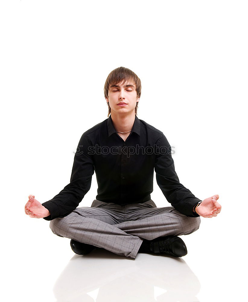 Similar – Anonymous man meditating during yoga training