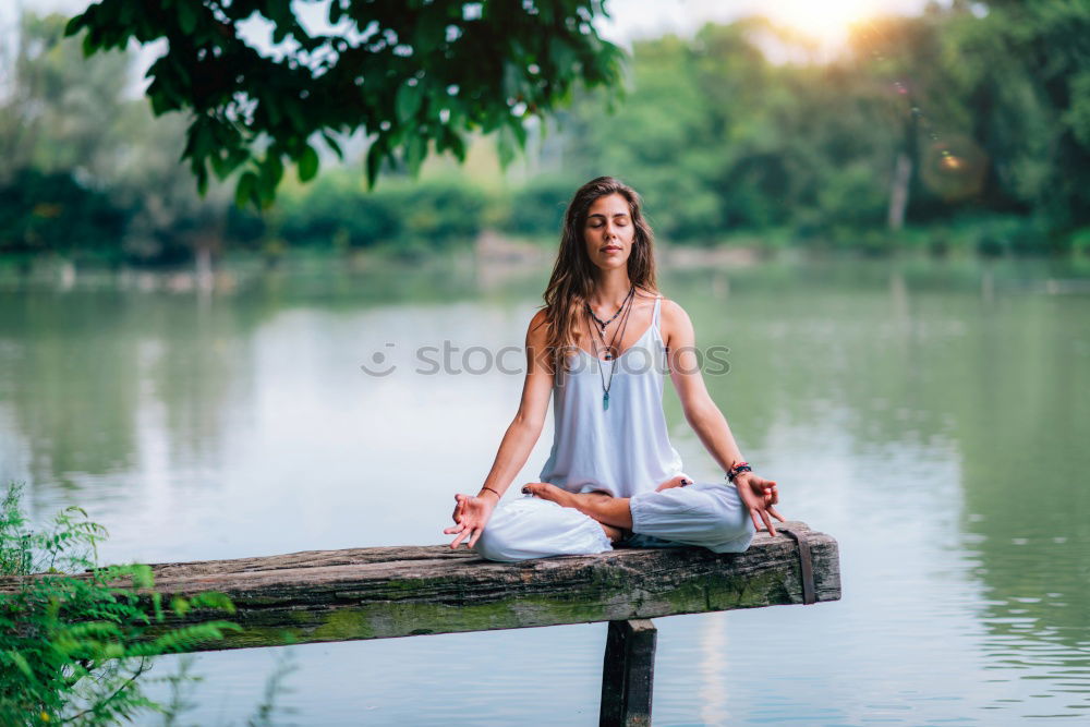 Image, Stock Photo Young woman doing yoga on wooden road in nature