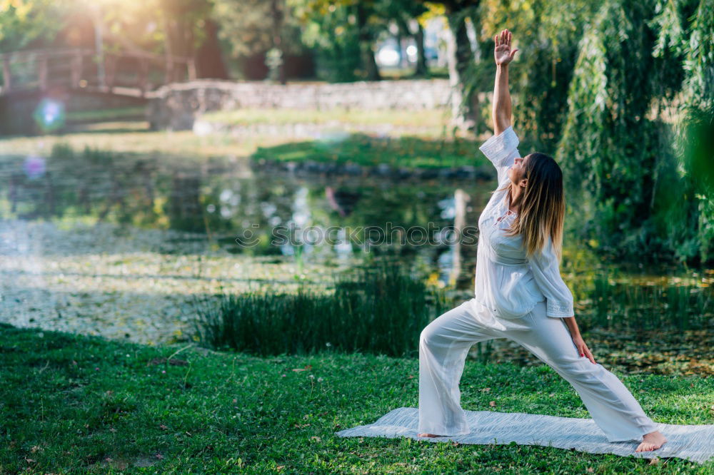 Image, Stock Photo Young woman doing yoga on wooden road in nature