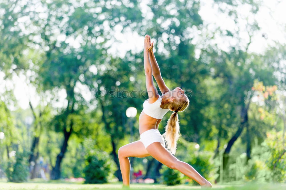 Similar – African American sportive woman sitting in lotus pose and stretching hands up