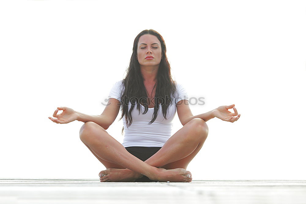 Similar – Anonymous man meditating during yoga training