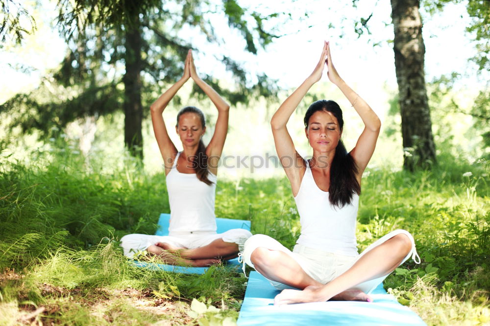 Similar – Image, Stock Photo Mother and daughter doing yoga exercises on grass in the park at the day time