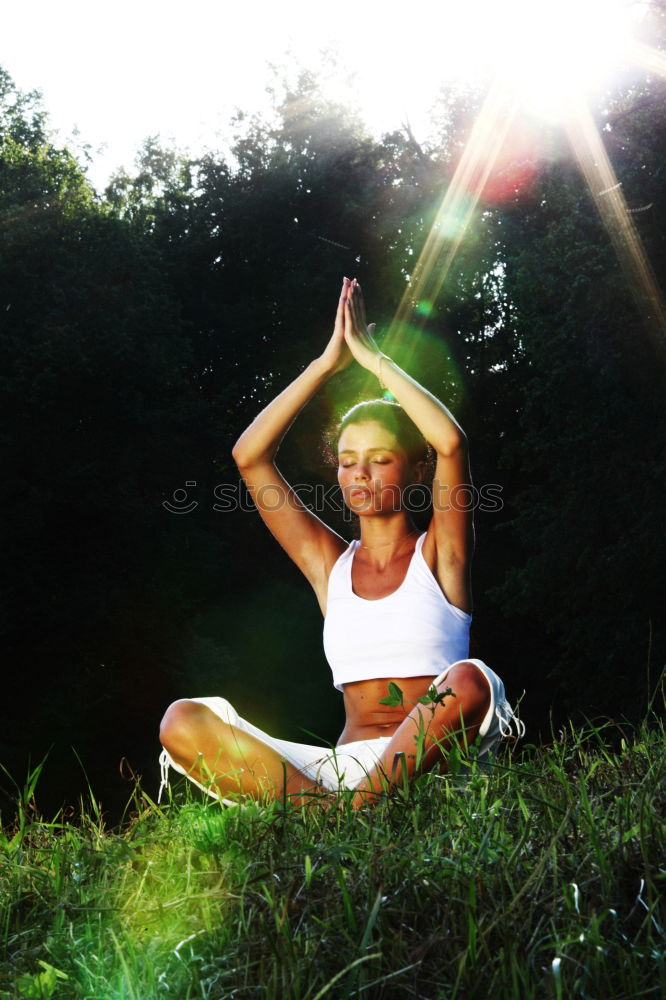 Similar – Young woman meditates in yoga asana Padmasana