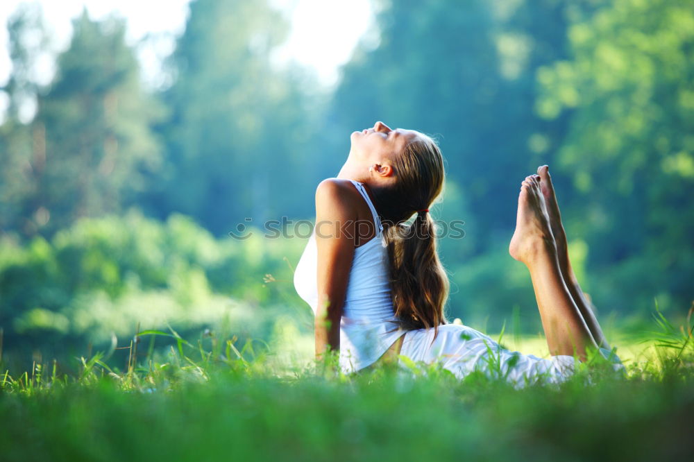 Similar – Image, Stock Photo Mother and daughter doing yoga exercises on grass in the park at the day time