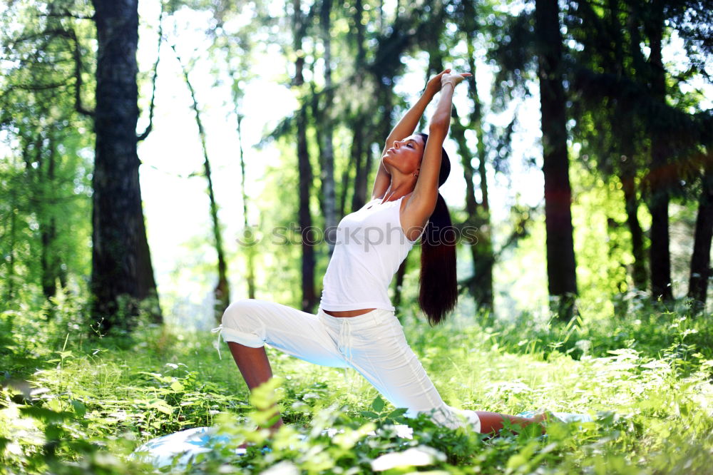 Similar – Image, Stock Photo Tattooed woman doing handstand/spagat on a birch tree