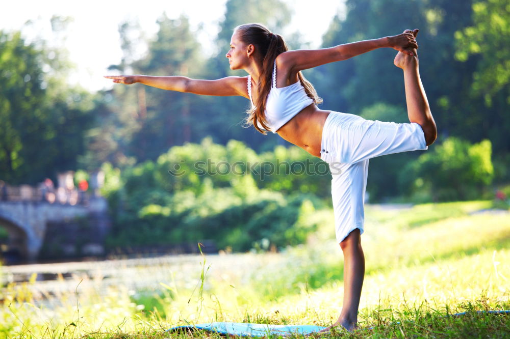 Similar – African American sportive woman sitting in lotus pose and stretching hands up