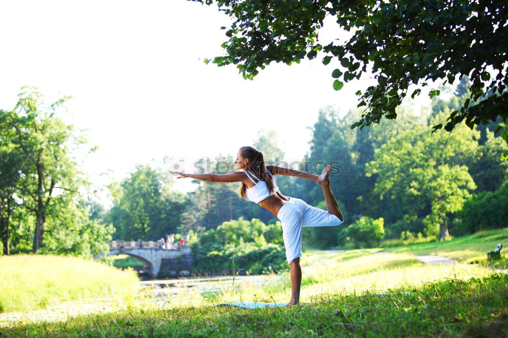 Similar – Image, Stock Photo Young woman doing yoga on wooden road in nature