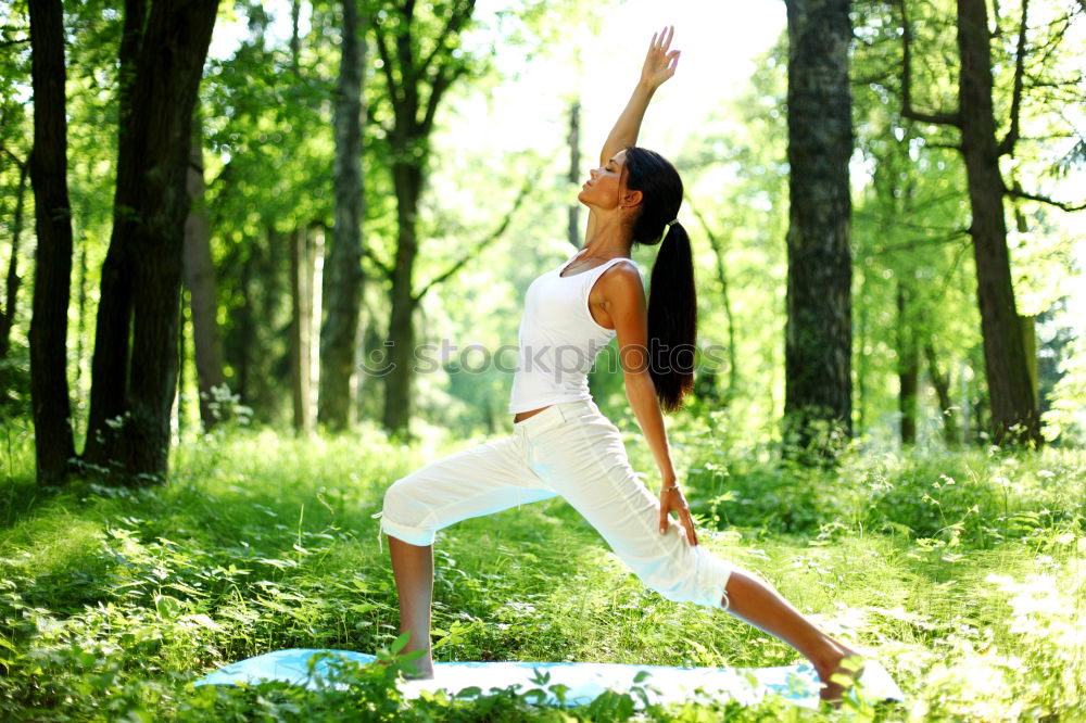 Similar – Young woman doing yoga in Nature.