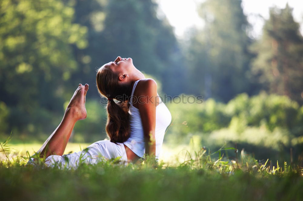 Similar – Image, Stock Photo Mother and daughter doing yoga exercises on grass in the park at the day time