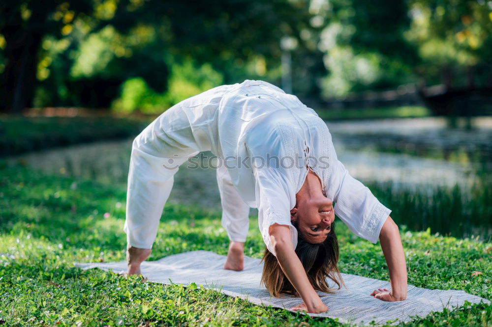 Similar – Image, Stock Photo Young woman doing yoga in nature.