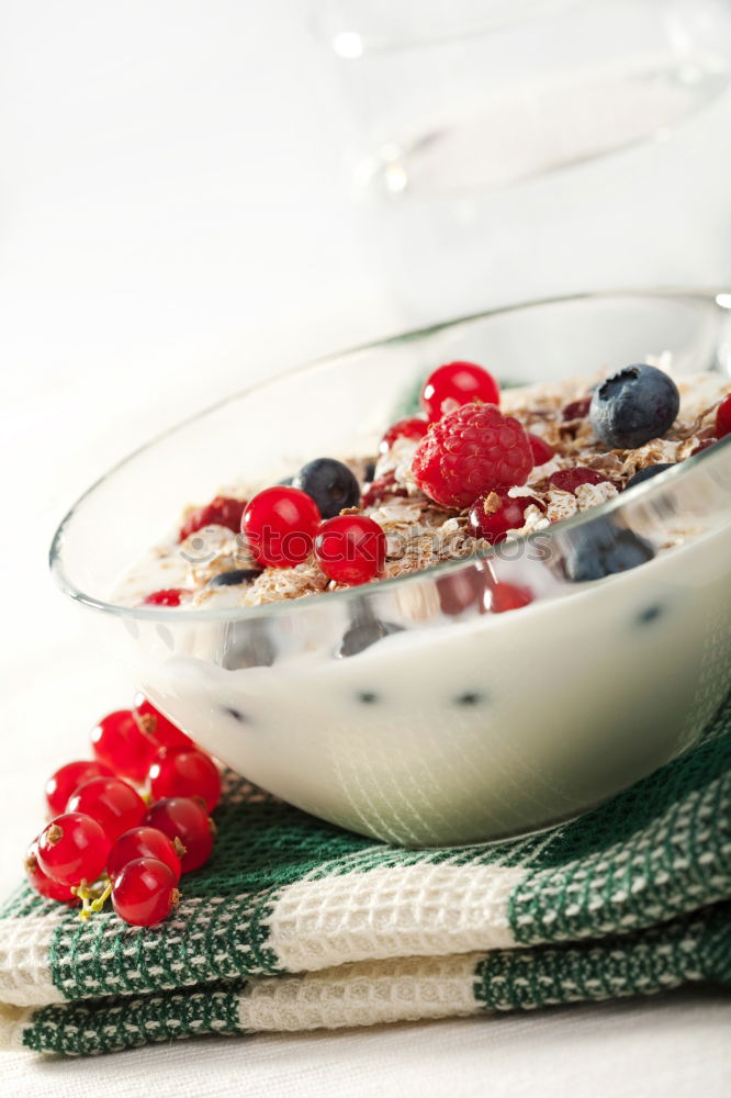 Similar – Oat flakes with milk and berries