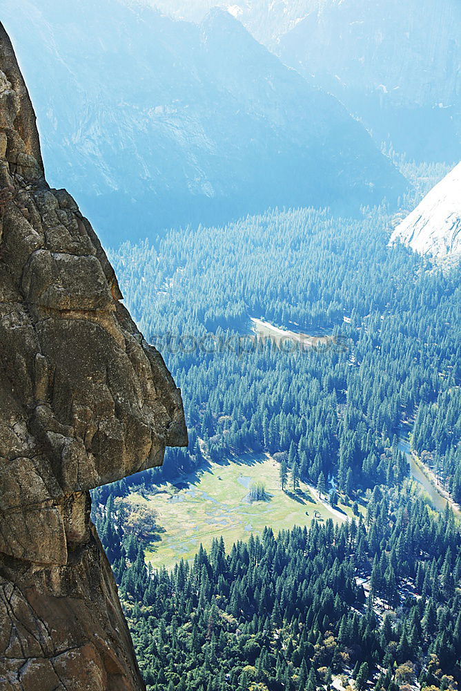 Similar – Team of climbers reaching the summit.