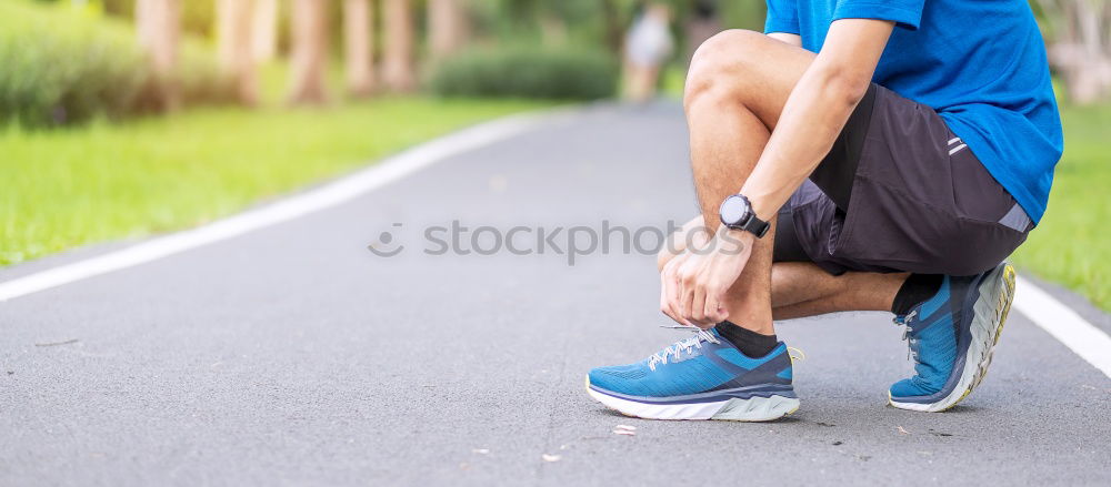 Similar – Sporty man sitting with towel and water bottle in gym floor