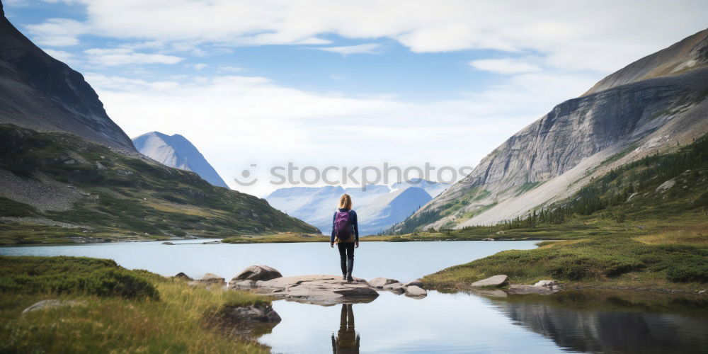 Similar – Backpacker jumping on landscape