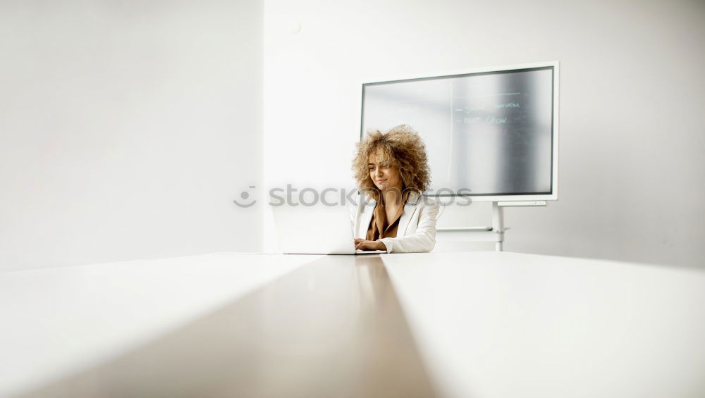 Similar – Businesswoman working on her laptop at work ( star-up concept )