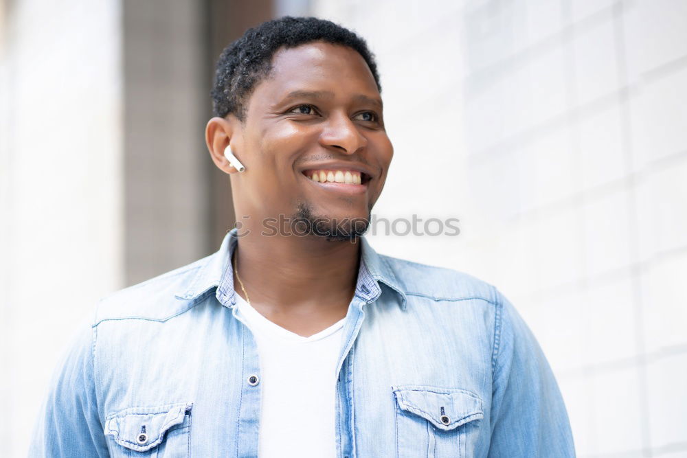 Similar – Image, Stock Photo Young black man wearing casual clothes walking smiling down the street