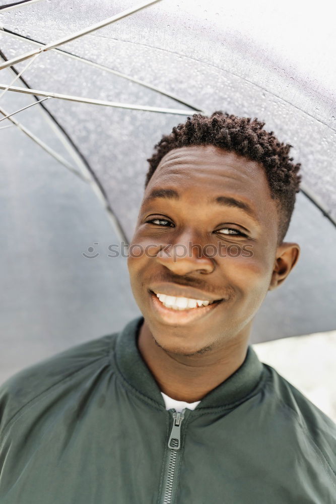 Similar – Young handsome black man holds a ice cream