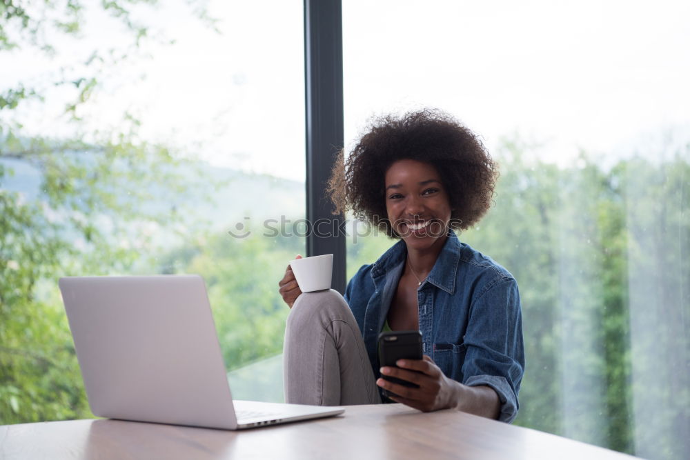 Similar – Beautiful afro american woman using mobile and laptop in the coffee shop.