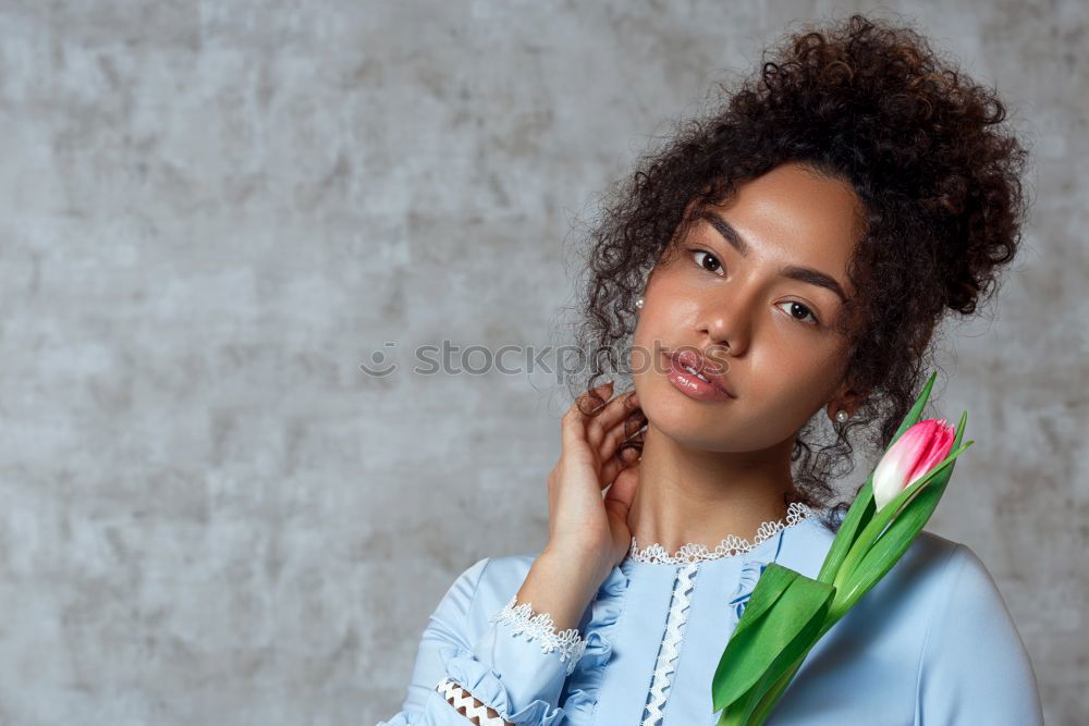 Similar – Thoughtful happy young black woman surrounded by flowers