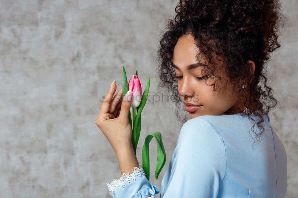 Similar – Thoughtful happy young black woman surrounded by flowers