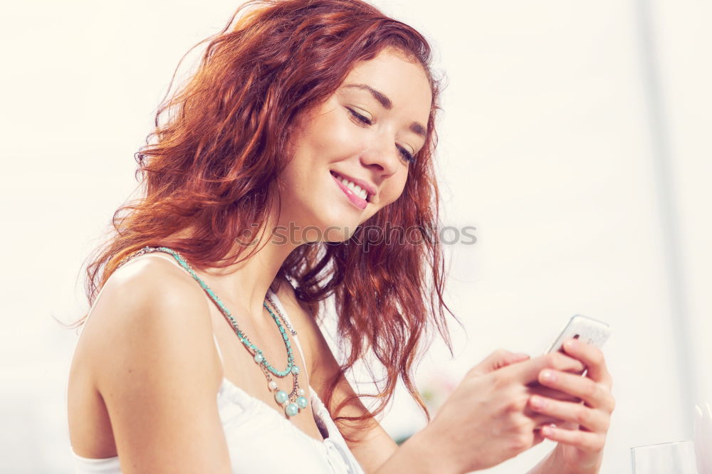 Similar – beautiful young woman using mobile phone and smiling