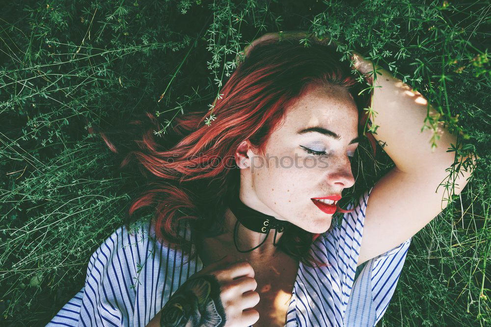 Image, Stock Photo Cheerful brunette woman lying in grass