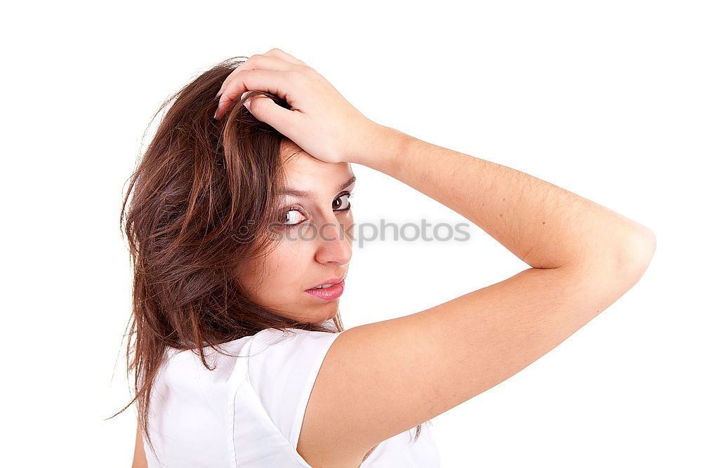 Similar – Portrait of a dark blond, long-haired woman looking into the camera through the hair on her face