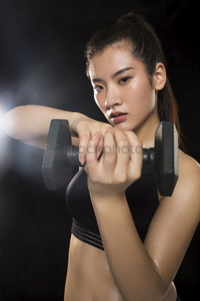 Similar – Image, Stock Photo Close up front portrait of one young athletic woman in sportswear in gym over dark background, standing in boxing stance with hands and fists, looking at camera