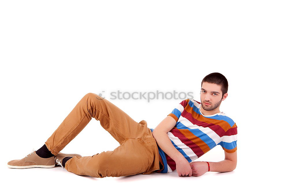 Similar – Young man sitting on the floor in urban background