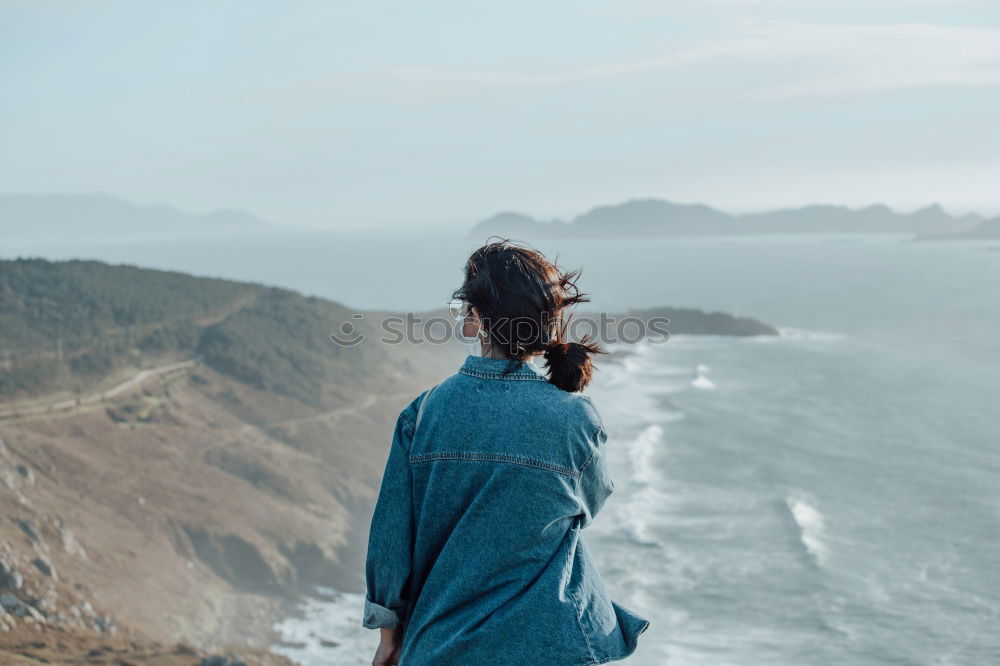 Man taking shot of island