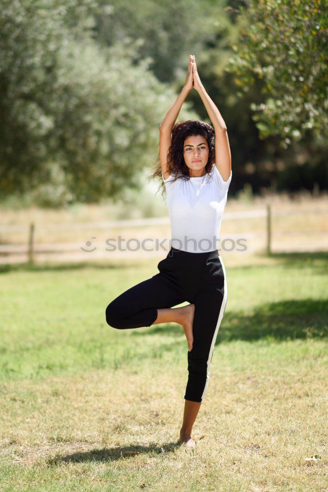 Similar – Image, Stock Photo Young Arab woman doing yoga in nature.