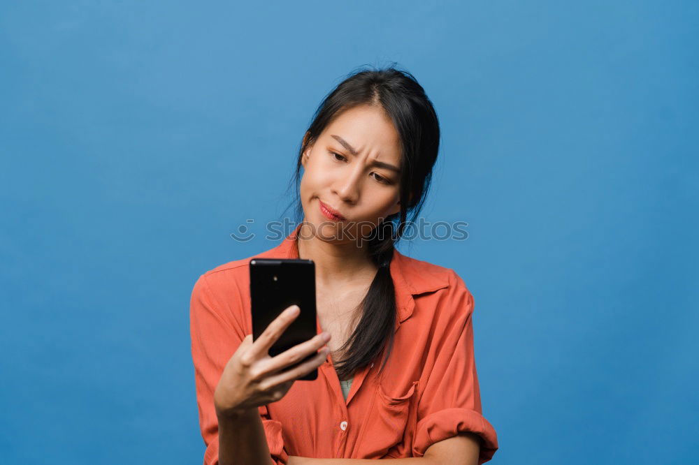 Similar – Image, Stock Photo Young woman in yellow dress using mobile phone