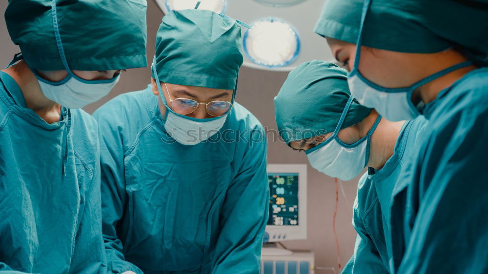 Similar – Image, Stock Photo Team of Surgeons Operating.