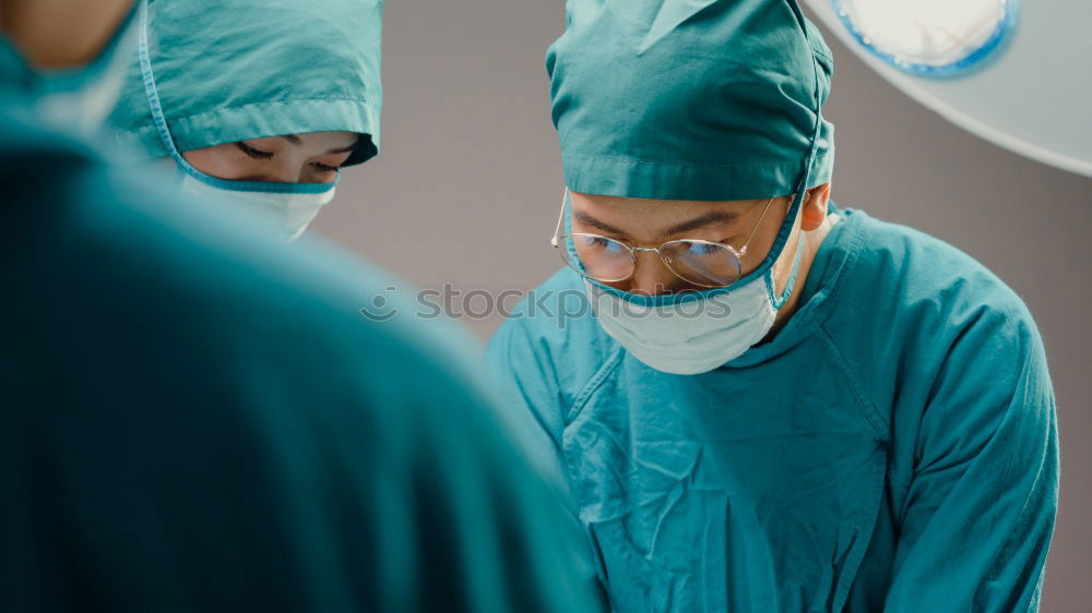Similar – Image, Stock Photo Team of Surgeons Operating.