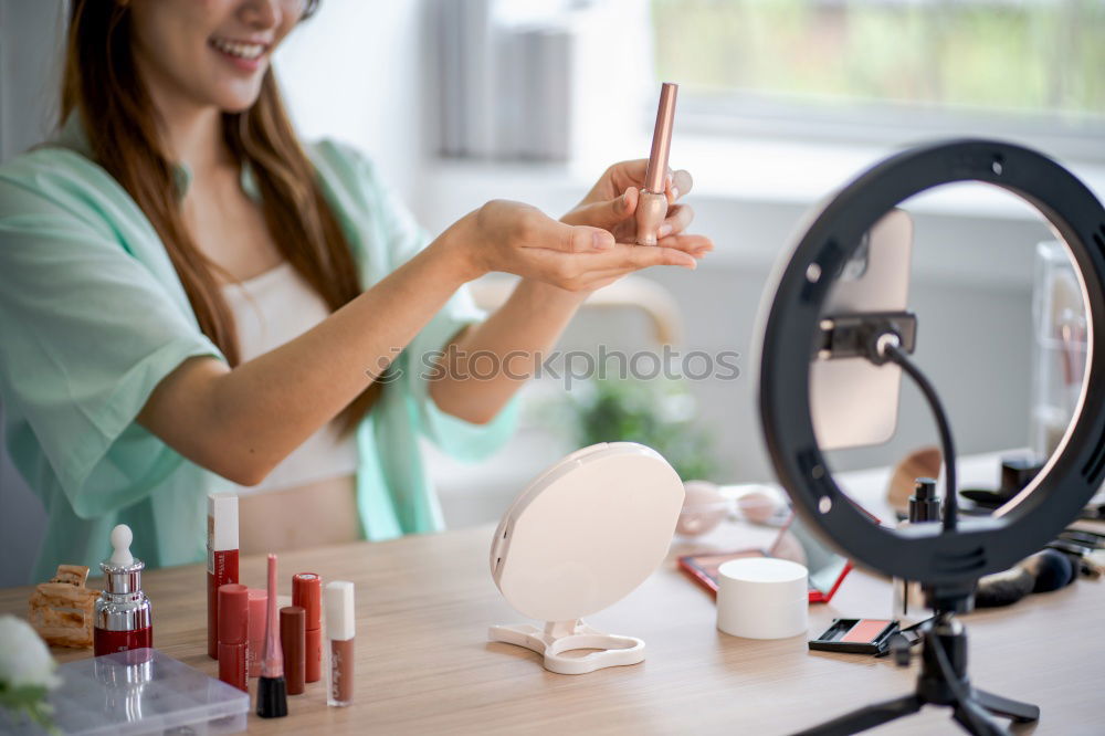 Similar – Young gender fluid person applying makeup at home