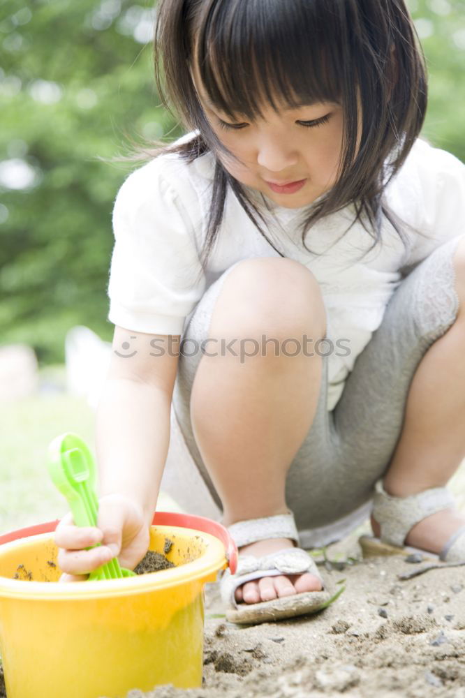 Similar – Image, Stock Photo child playing with sand