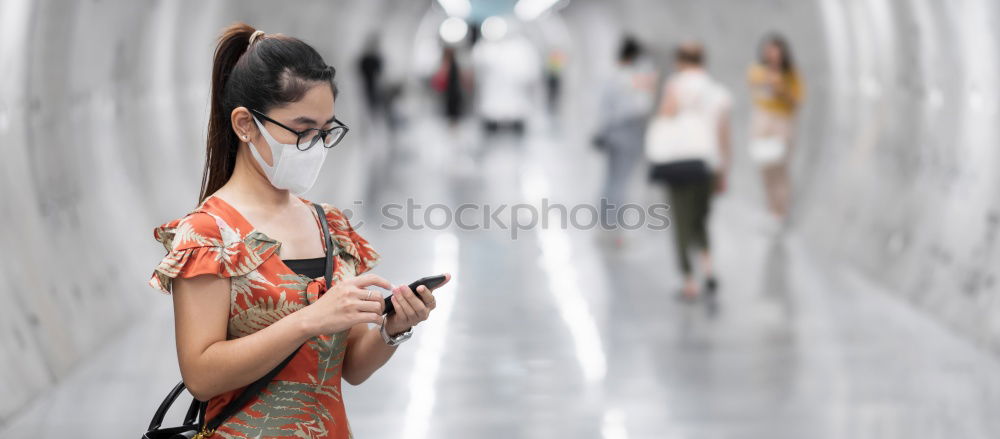 Similar – Image, Stock Photo Young woman with mobile phone walking a city street