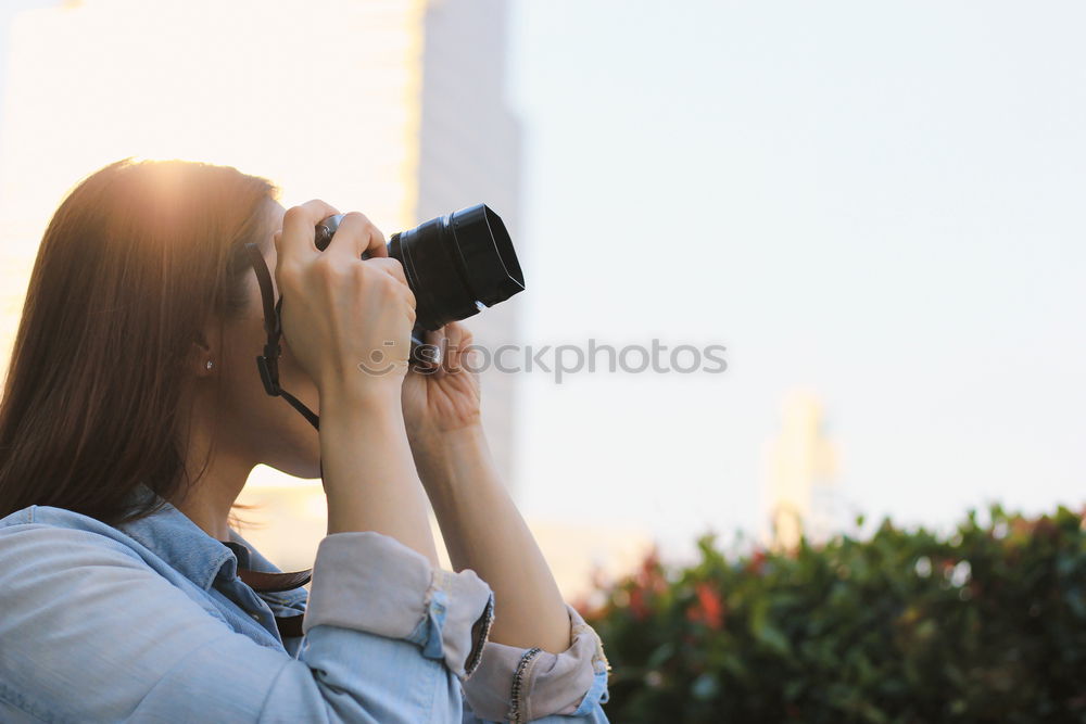 Similar – Image, Stock Photo Young woman using a camera to take photo.