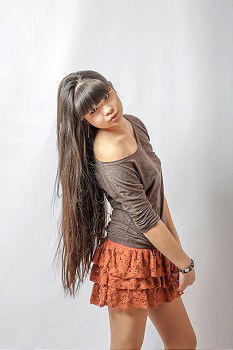 Similar – Image, Stock Photo Young athletic woman with long legs stands sideways in front of white wall and looks into camera