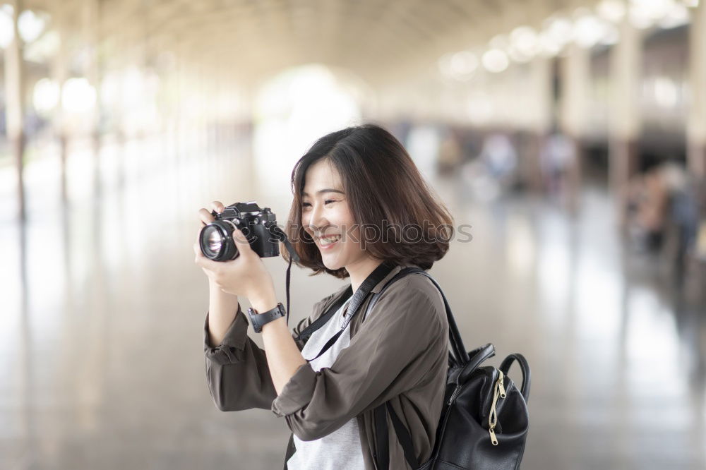 Similar – Image, Stock Photo Young woman using a camera to take photo.