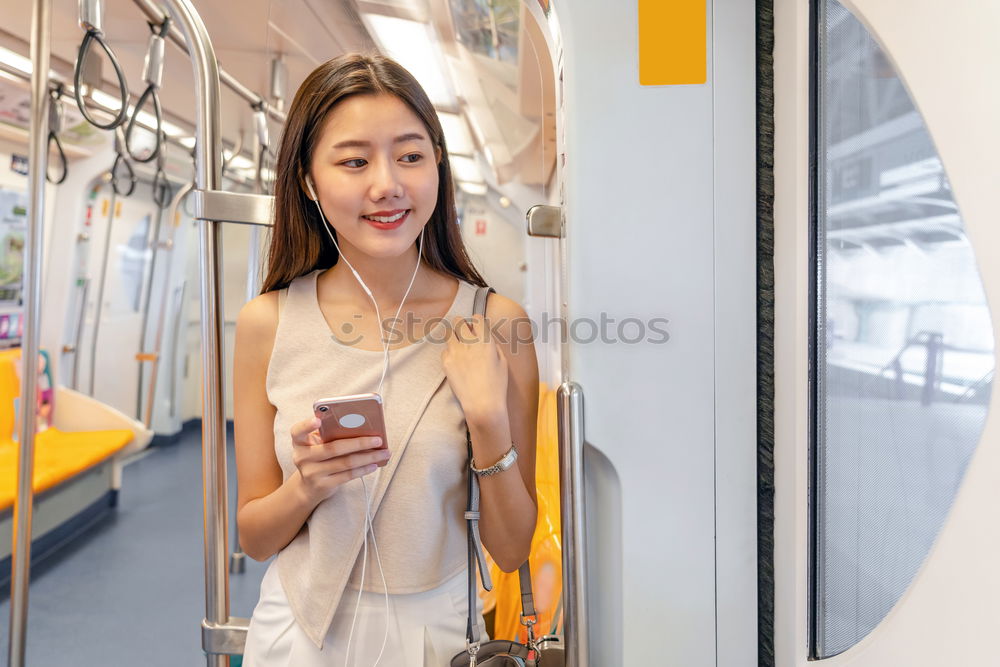 Similar – Foto Bild Jugendliche mit Rucksack und Smartphone in der U-Bahn-Station