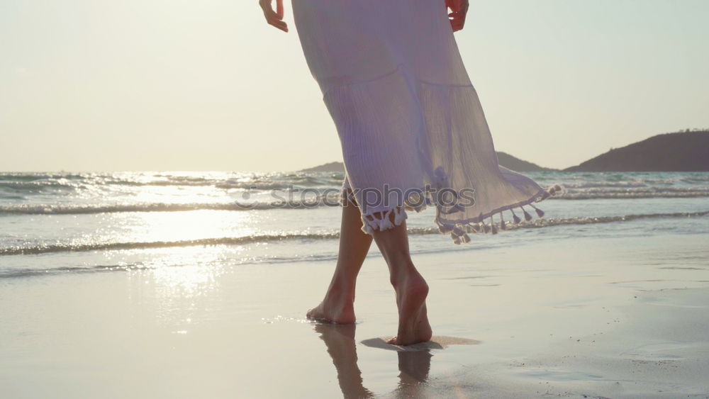 Similar – Young woman sitting alone on the beach and has wanderlust