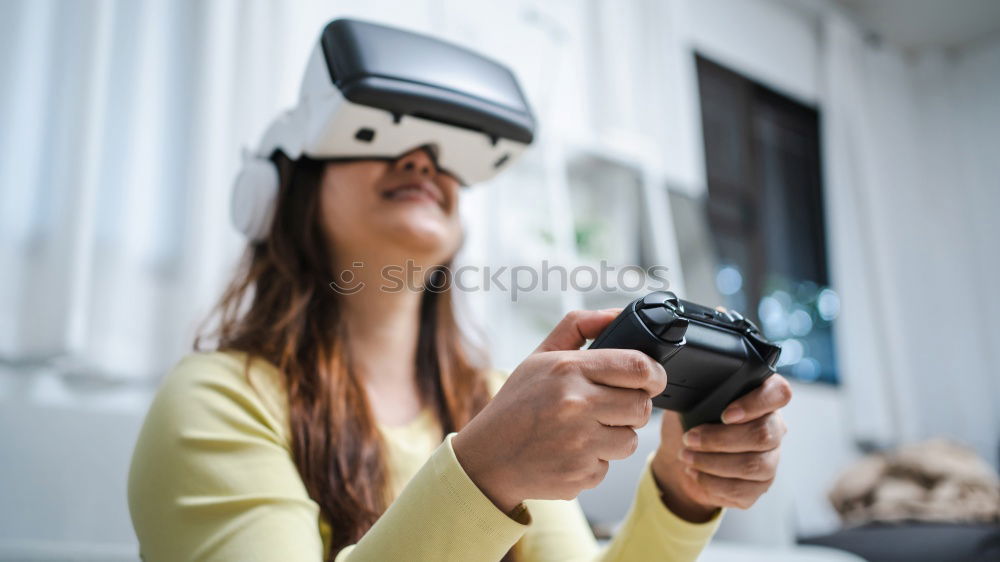 Similar – woman wearing 3d vr goggles, driving car in virtual space