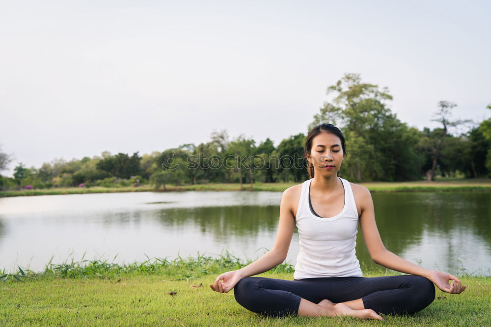 Woman Meditating And Practicing Yoga, Padmasana.