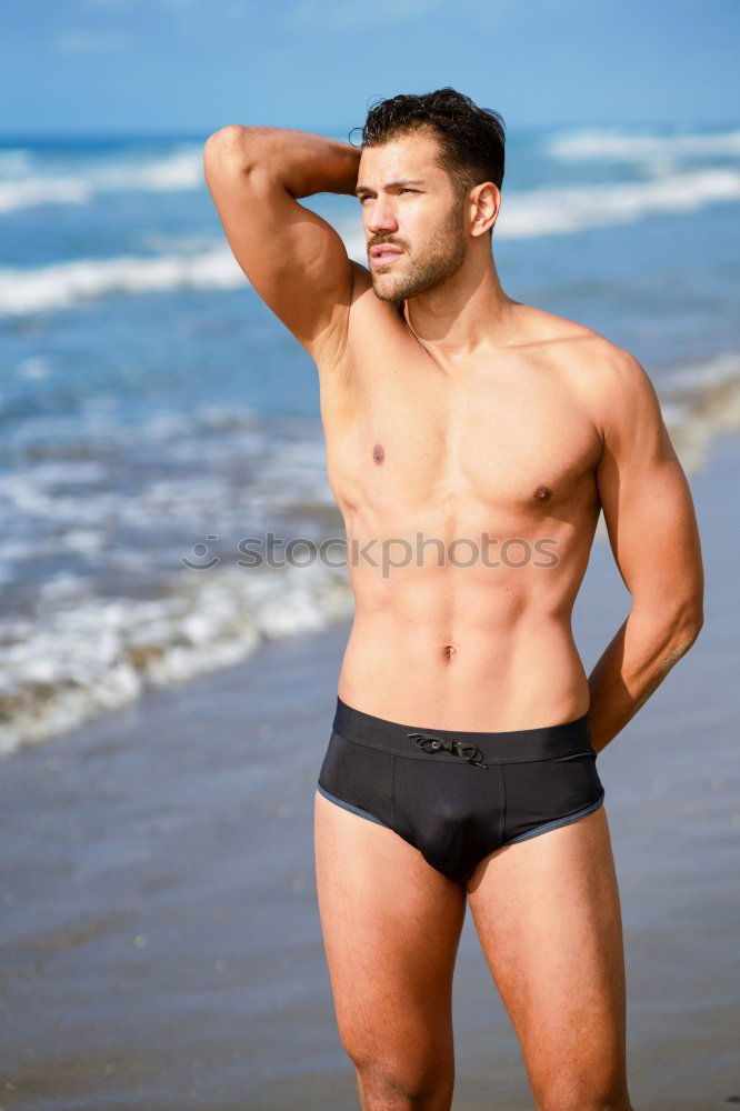 Similar – Handsome man on his knees on the sand of the beach