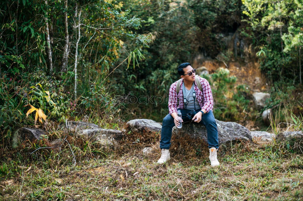 Similar – Couple kissing while making a break to do trekking