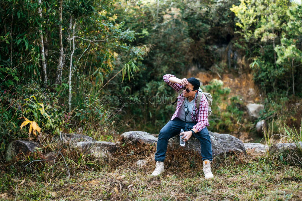 Similar – Couple kissing while making a break to do trekking