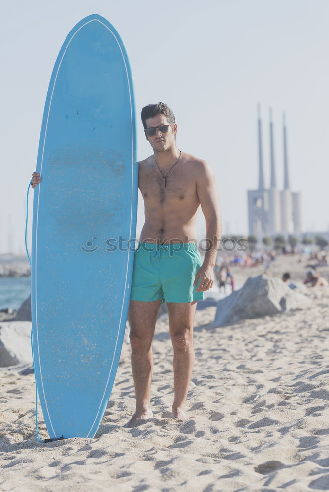 Similar – Young attractive surfer holding his surfboard at the beach