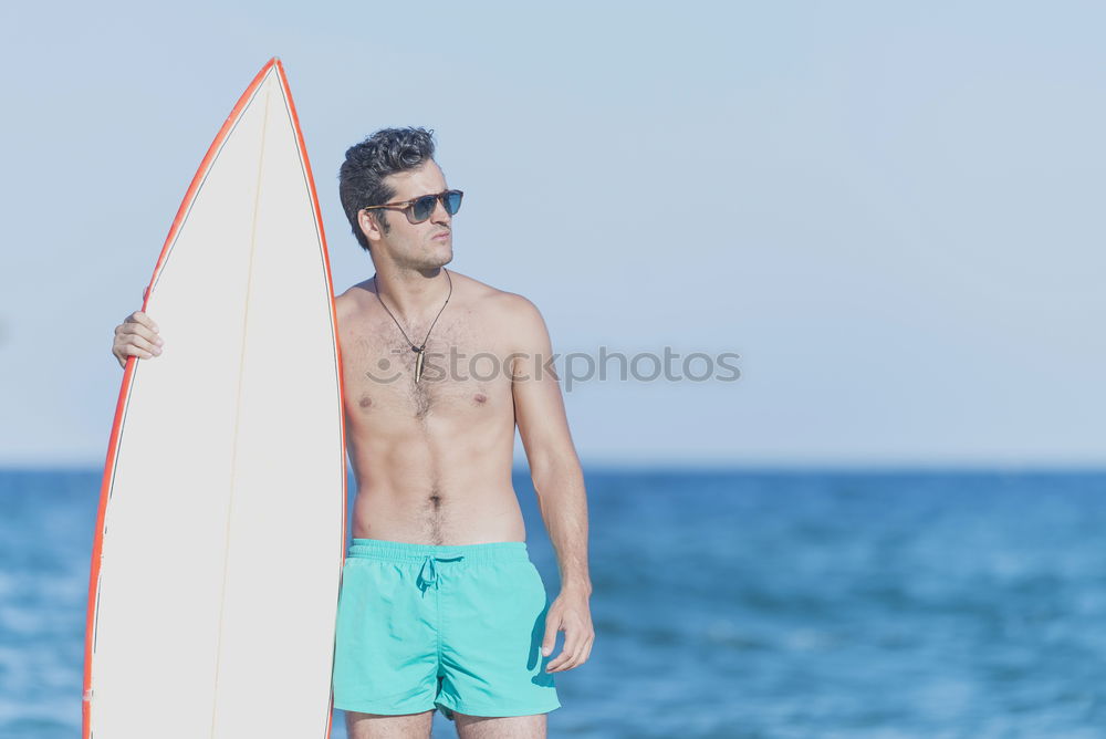 Similar – Young attractive surfer holding his surfboard at the beach